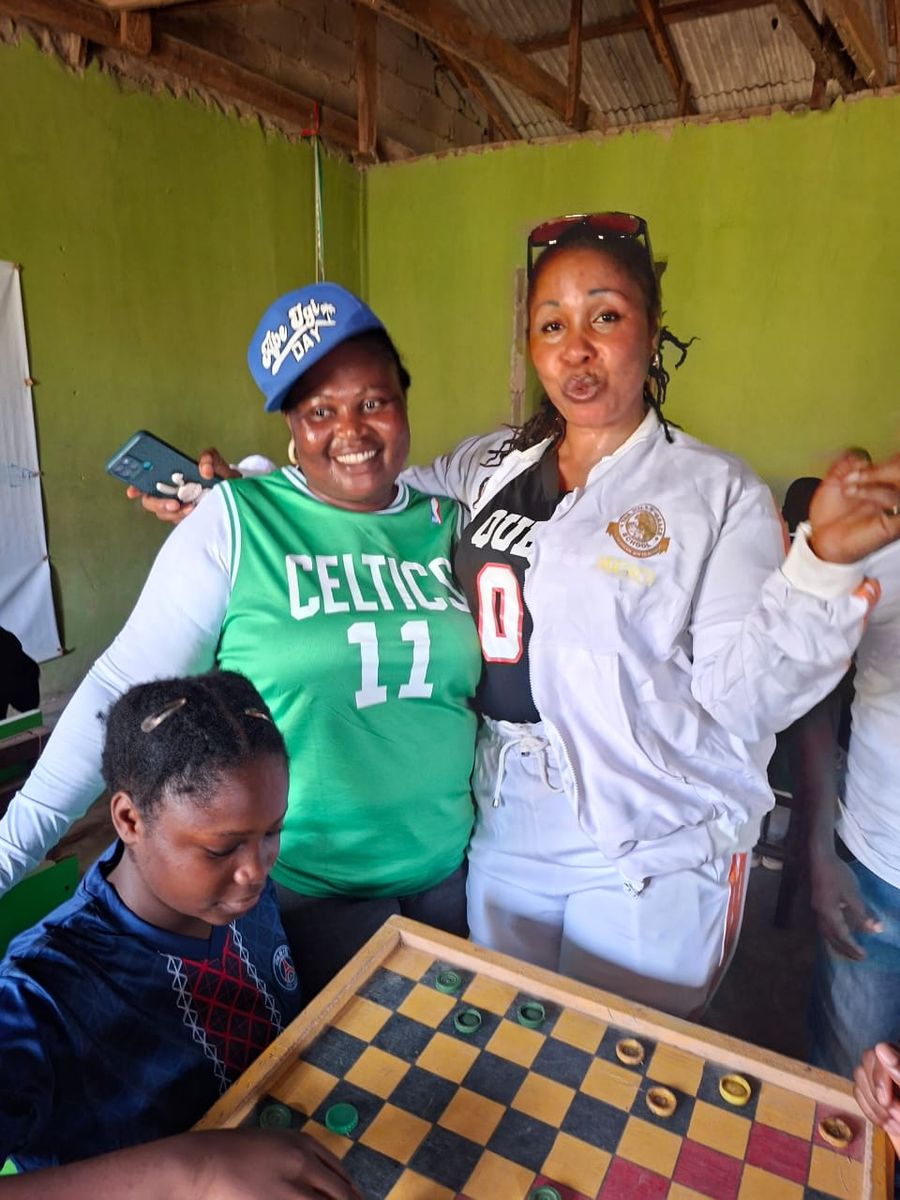 Pupils playing a board game at Hills-Grace Schools